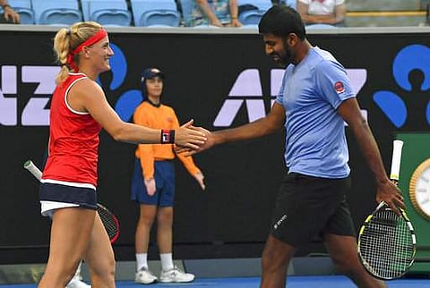 Hungary's Timea Babos and India's Rohan Bopanna exchange gesture in their mixed doubles game. | AP