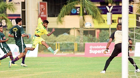 Rishabudeen of SS College, Areacode, heads in the opening goal against St Joseph’s College, Devagiri, in the TNIE GOAL all-Kerala inter-collegiate football tournament at Maharaja’s College Stadium, Kochi on Thursday