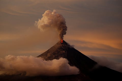 Mayon volcano erupts anew at sunset in Albay province around 200 miles southeast of Manila. (Photo | AP)