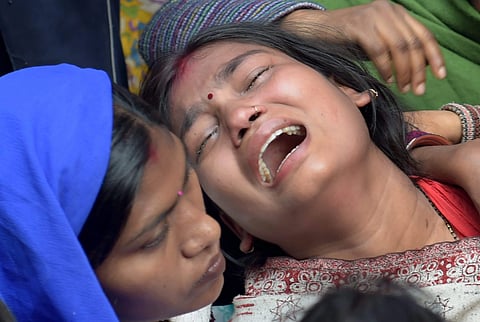Relatives of a Bawana fire victim mourns at her house in New Delhi. (File photo | PTI)