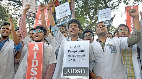 AIDSO activists stage protest against National Medical Commission Bill in Bengaluru on Tuesday | Vinod Kumar T