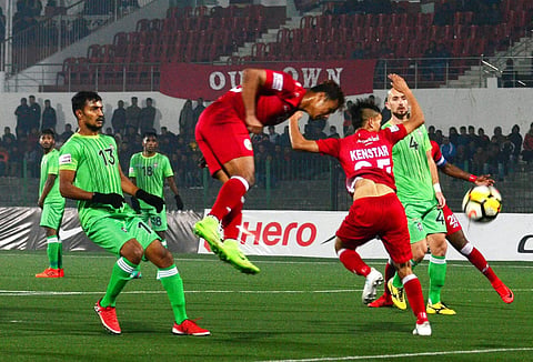 An action moment from the Hero I League Football played between Shillong Lajong FC red jersey and Chennai City green jersey during their Indian Super League Football 2017-18 match at Jawaharlal Nehru Stadium Shillong Meghlaya on Friday. (Photo: PTI)