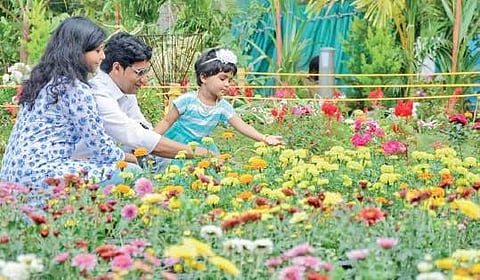 People enjoying the flowers at Vasantholsavam at Kanakakunnu Palace premises B P Deepu