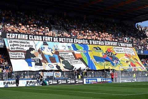 Montpellier's supporters react during the French L1 football match between Montpellier and Nimes, on September 30, 2018 at the the Mosson stadium in Montpellier, southern France. | AFP