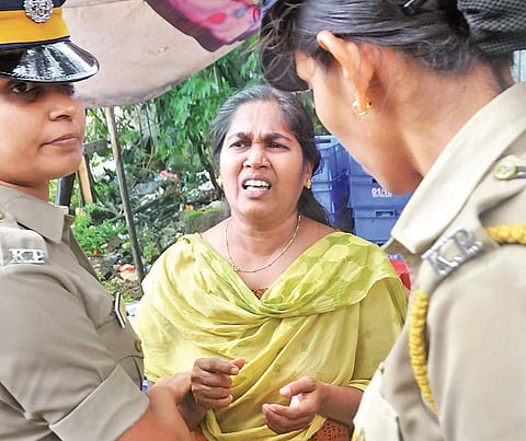 Preetha Shaji being taken into custody. (Photo | EPS)