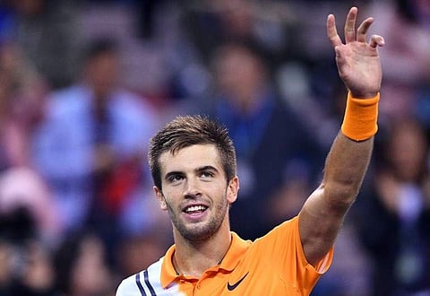 Borna Coric of Croatia reacts after winning against Roger Federer of Switzerland in their men's singles semi-final match at the Shanghai Masters tennis tournament on October 13, 2018. | AFP