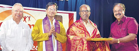 Mudhra Bhaskar, trustee, felicitates Dr Va Ve Su, at first anniversary celebration Martin Louis