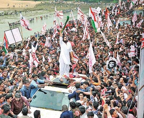 Jana Sena Party president Pawan Kalyan and his supporters at Dowleswaram barrage in Rajamahendravaram on Monday I Express