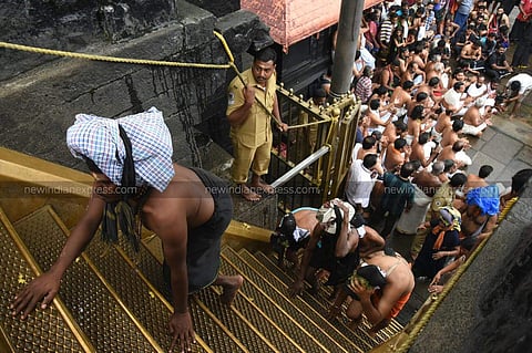 Sabarimala temples aides at the foot of the 18 steps of the hill shrine protesting against the two women who attempted to enter Sabarimala hill shrine on October 19, 2018. (Photo | BP Deepu/ EPS)