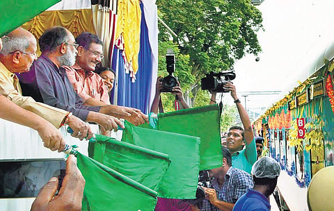 Union Minister of State for Culture and Tourism Alphons Kannanthanam flagging off the Kochuveli - Banaswadi Humsafar Express at Kochuveli railway station on Saturday. A Sampath MP and O Rajagopal MLA are also seen | Express