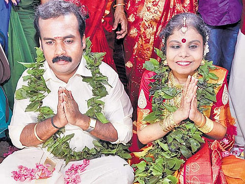 Vaikom Vijayalakshmi with her husband Anoop after tying the knot at Vaikom on Monday
