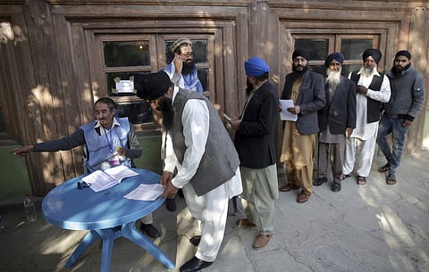 Voters from the minority Sikh register to cast in Parliamentary elections in old city of Kabul, Afghanistan. ( File Photo | AP)