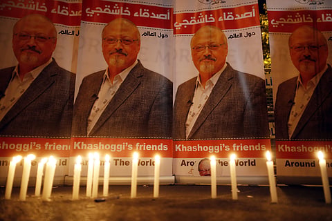 Candles, lit by activists, protesting the killing of Saudi journalist Jamal Khashoggi, are placed outside Saudi Arabia's consulate, in Istanbul, during a candlelight vigil. ( Photo | AP)