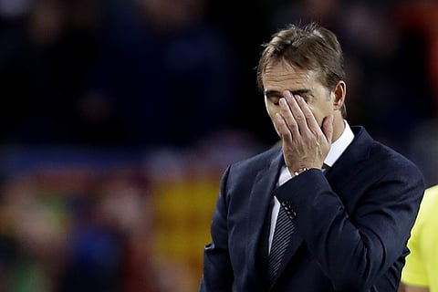 Real coach Julen Lopetegui gestures as walks off the pitch after losing 5-1 during the Spanish La Liga soccer match between FC Barcelona and Real Madrid at the Camp Nou stadium in Barcelona, Spain, Sunday, Oct. 28, 2018. | AP