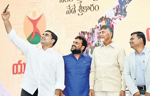 IT Minister Nara Lokesh taking a selfie with Chief Minister Nara Chandrababu Naidu and others during the launch of Mukhyamantri Yuva Nestham at Undavalli on Tuesday. I Express Photo Services