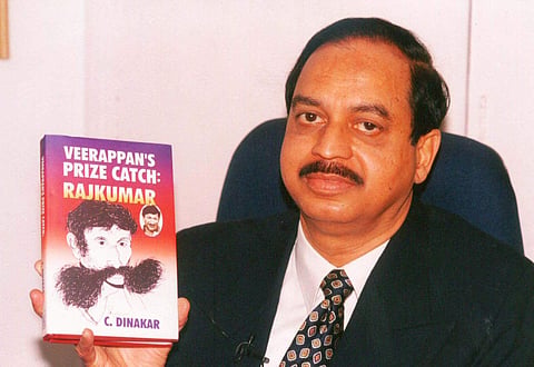 Late DG & IGP C Dinakar with his book on Veerappan in 2003. (File photo | EPS)