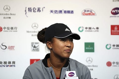 Naomi Osaka of Japan attends a press conference after losing in her women's singles semifinal match in the China Open at the National Tennis Center in Beijing. (Photo | AP)