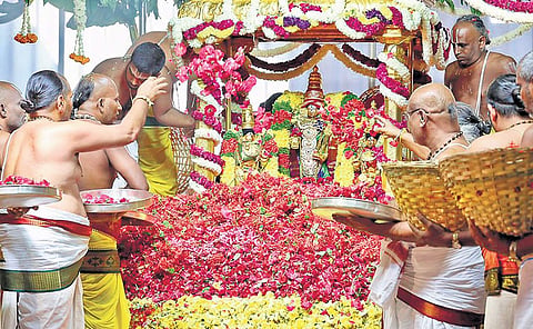 Priests offering flowers to the deity of Lord Malayappa Swamy and His two consorts during Pushpa Yagam performed at Tirumala temple on Wednesday | Express