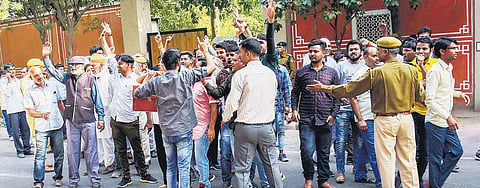 BJP workers protest outside Chief Minister Vasundhara Raje’s residence to seek tickets, in Jaipur on Thursday | pti