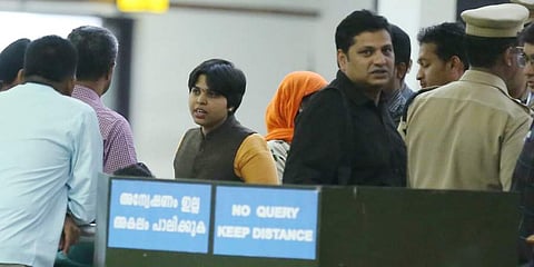 Social activist Trupti Desai (in yellow kurta) at the Kochi airport. (Photo| Special arrangement)