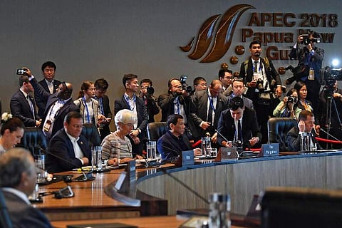 International Monetary Fund (IMF) managing director Christine Lagarde (3rd L) sits next to Philippine President Rodrigo Duterte (C) during a session at the Asia-Pacific Economic Cooperation (APEC) Summit in Port Moresby on November 18, 2018. (Photo | AFP