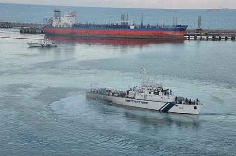 Coast Guard officials inspecting the oil spill Marine Liquid Terminal on Sunday. (Photo | By special arrangement)