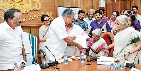 Chief Minister Pinarayi Vijayan presenting the certificate to Karthyayani Amma, who scored 98 marks in the ‘Aksharalaksham’ literacy examination, on Thursday | Express