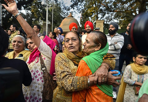 Family members of the victims of 1984 anti-Sikh riots celebrate outside the Patiala House Court in New Delhi Tuesday after the pronouncement of the first death punishment in the case. (Photo | PTI)