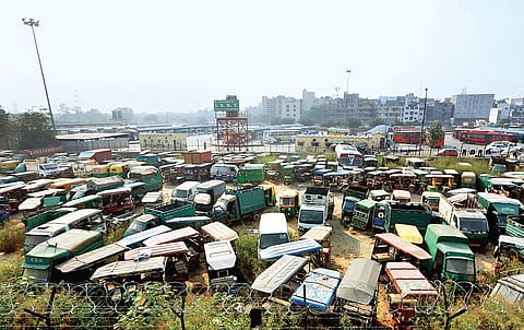Ten-year-old diesel vehicles and 15-year-old petrol cars parked in a field at Sarai Kale Khan in New Delhi after being impounded