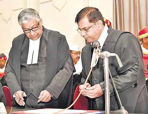Chief Justice TBN Radhakrishnan administers the oath to Justice Raghvendra Singh Chauhan as Hyderabad HC judge on Thursday | Express