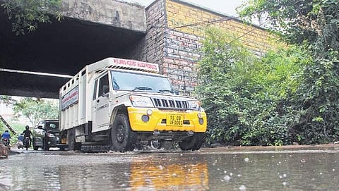 Vehicles passing through the stagnated drainage water under the railway bridge near Hitec city railway station | S Senbagapandiyan