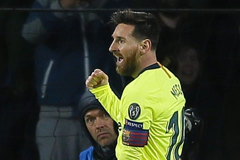 Barcelona captain Lionel Messi celebrates scoring his side's first goal during a Group B Champions League soccer match against PSV Eindhoven | AP