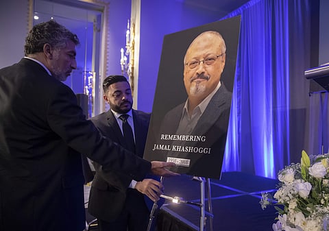 Mongi Dhaouadi, left, and Ahmed Bedier set up an image of slain Saudi journalist Jamal Khashoggi before an event to remember Khashoggi, a columnist for The Washington Post who was killed inside the Saudi Consulate in Istanbul on Oct. 2, in Washington, Fri