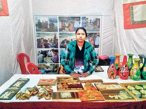 Wooden calligrapher of Nuapada makes a mark at Baliyatra