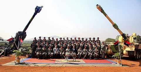 Defence Minister Nirmala Sitharaman Army Chief General Bipin Rawat and others pose for a group photograph at the formal induction of three major artillery gun systems including the M777 American Ultra Light Howitzers and the K-9 Vajra into the Army during
