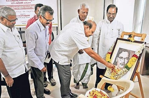 Floral tributes being paid to Mallampalli Somasekhara Sarma on the occasion of his birth anniversary at Cultural Centre of Vijayawada and Amaravati in city I express