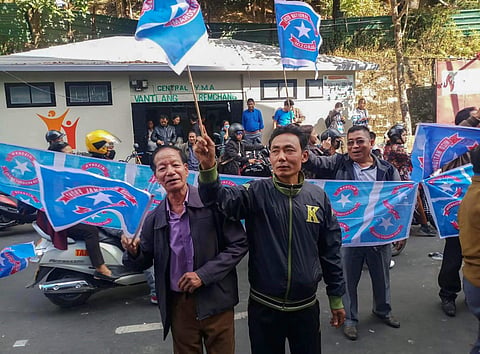 Mizo National Front MNF workers holding their party flag. Image used for representational purposes