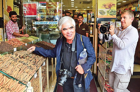 Photojournalist Nick Ut with photographer Mark Edward Harris at a spices shop at Broadway on Tuesday | Albin Mathew