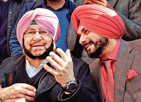 File photo of Navjot Singh Sidhu with Punjab CM Amarinder Singh | PTI