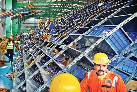 Firemen, NDRF and SDRF personnel at the warehouse at Seegehalli in Bengaluru on Thursday | Pushkar V