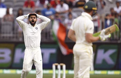 India's captain Virat Kohli (L) yells at Australia's captain Tim Paine (R) on the third day of the second cricket Test match in Perth. (Photo | AFP)