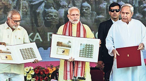PM Narendra Modi, Governor Prof Ganeshi Lal and CM Naveen Patnaik releasing commemorative stamp and coin to mark 200 years of 1817 Paika Rebellion at Arugul on Monday | Express