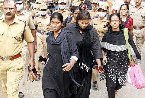 Members of the Manithi team were asked to return midway after protesters disrupted their trek to the holy shrine on Sunday. (Photo | EPS)