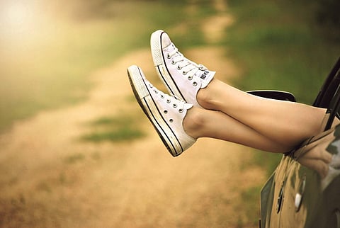 Image of white canvas shoes used for representational purpose only.