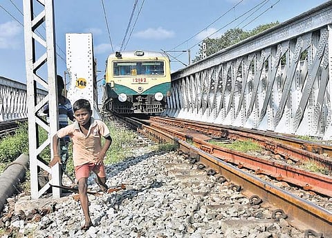 Trains moving on the road-overbridge in the Korukkupet-Basin Bridge section