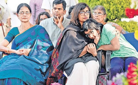 The grieving family members of IPS officer Madhukar Shetty at the Armed Police Training School, Yelahanka, where the officer’s body was kept for the public to pay homage on Saturday | Nagaraja Gadekal