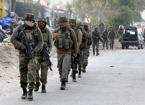Security personnel take positions during a militants attack at Sunjwan Army camp in Jammu on Saturday. | PTI