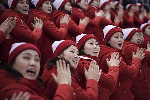 North Korean supporters cheer during the preliminary round of the women's hockey game between Switzerland and the combined Koreas at the 2018 Winter Olympics in Gangneung, South Korea, Saturday, Feb. 10, 2018. | AP