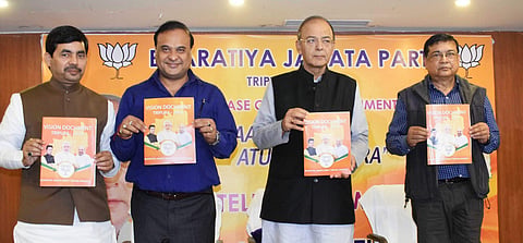 BJP leader and Finance Minister Arun Jaitley along with party leaders Syed Shahnawaj and Himanta Biswa Sarma releases party's vision document for the Assembly polls in Agartala on Sunday | PTI