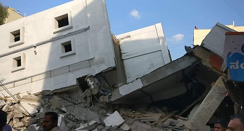 The debris of the collapsed building in Karnataka's Bellandur on Thursday. (EPS)